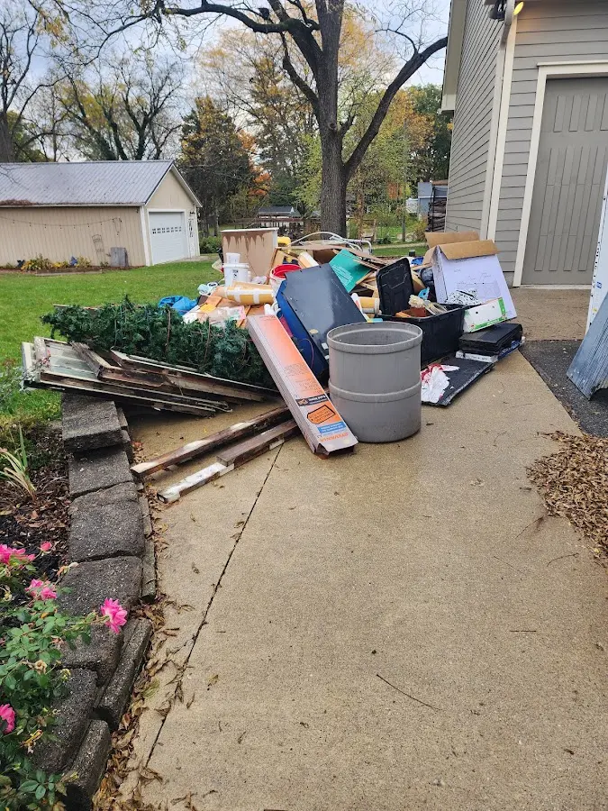 Dumpster being loaded with debris for 30 Yard Dumpster Rental in Woodstock